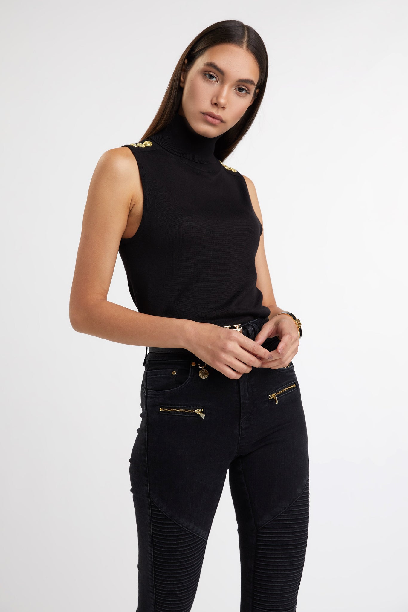 fitted lightweight sleeveless rollneck knit in black with gold button detail across shoulders