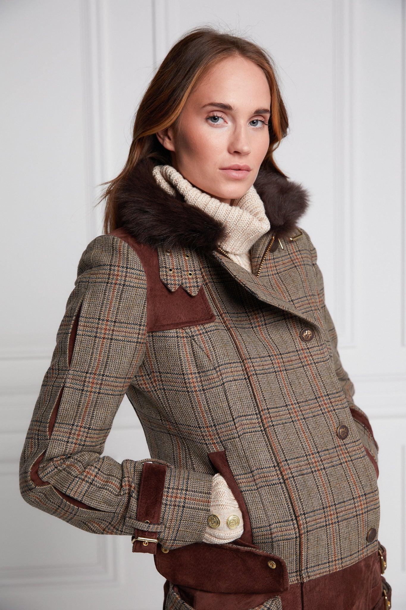 womens fitted field jacket in taupe brown orange and blue tweed trimmed with contrast chocolate suede on shoulder across back and on the hip with faux fur trim around the neck finished with horn button fastenings an buckles on the collar cuffs and hip