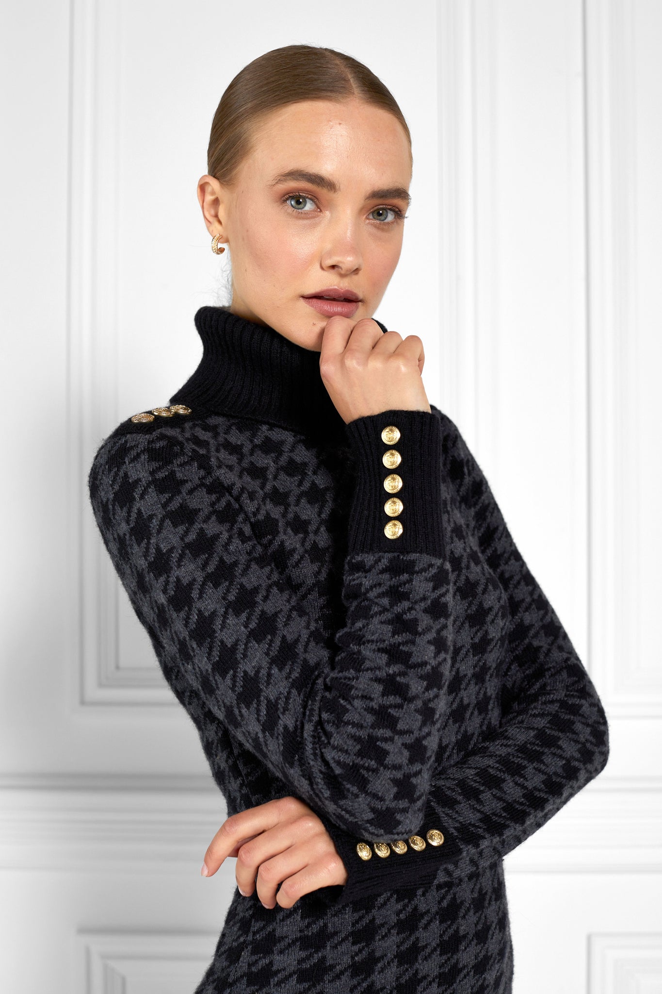 womens black and dark grey houndstooth roll neck jumper dress with contrast black cuffs and ribbed hem with gold button detail on the cuffs and shoulders