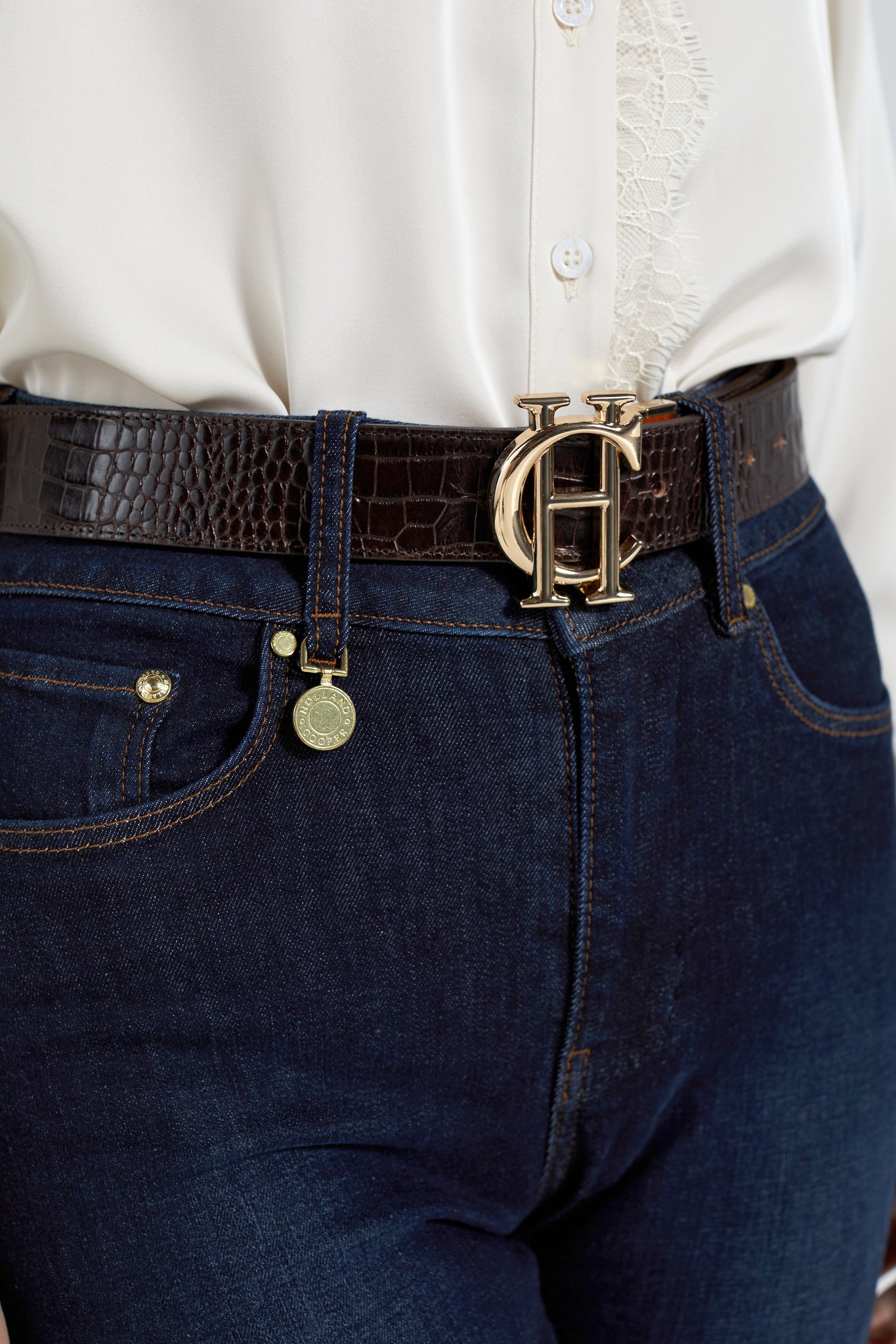 genuine leather reversible belt with orange on one side and chocolate croc on the other featuring large gold hc belt fastening and 2 belt loops in both colours