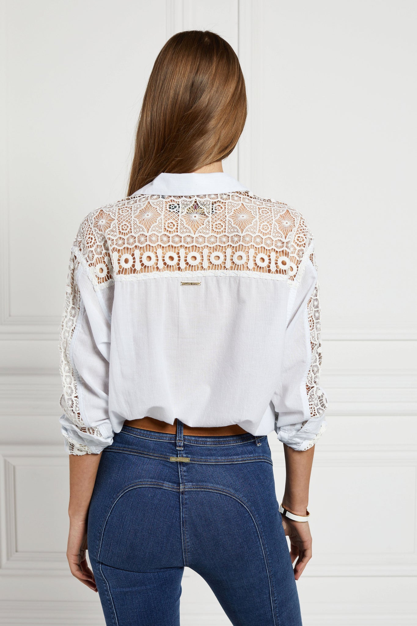 back image of relaxed shirt with pale blue and white stripes with lace panel insert across the back yolk and down the sleeves