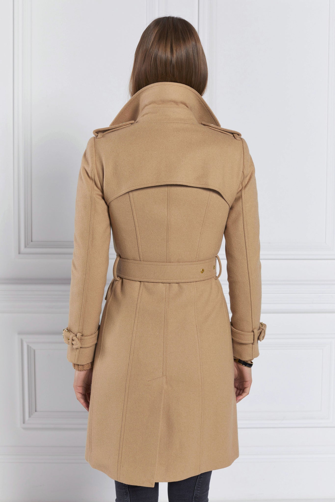 back of womens camel detailed with gold hardware knee length wool trench coat