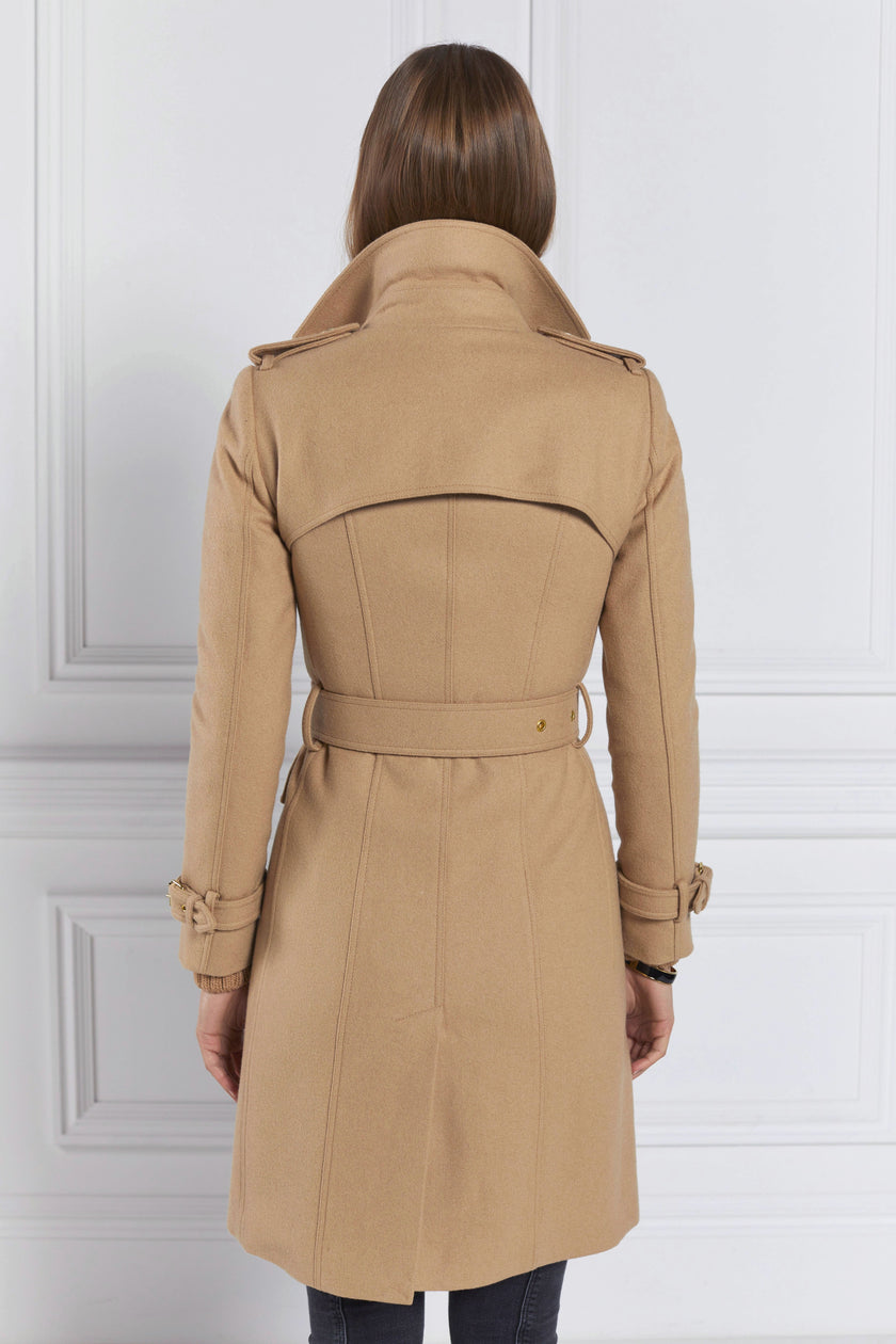 back of womens camel detailed with gold hardware knee length wool trench coat