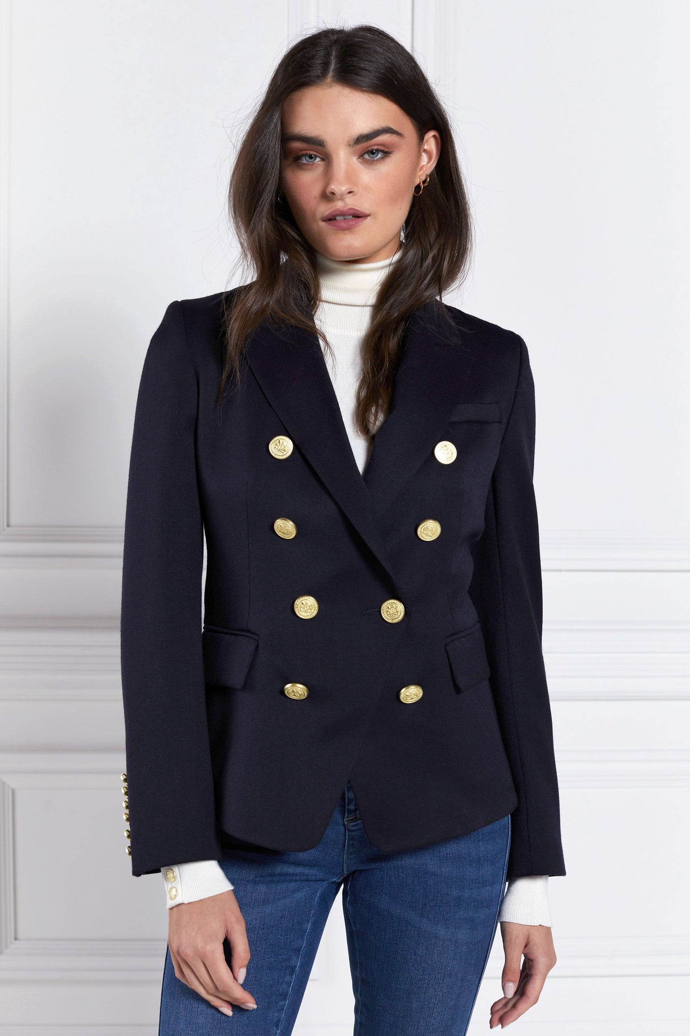 British made double breasted blazer that fastens with a single button hole to create a more form fitting silhouette with two pockets and gold button detailing this blazer is made from navy barathea fabric