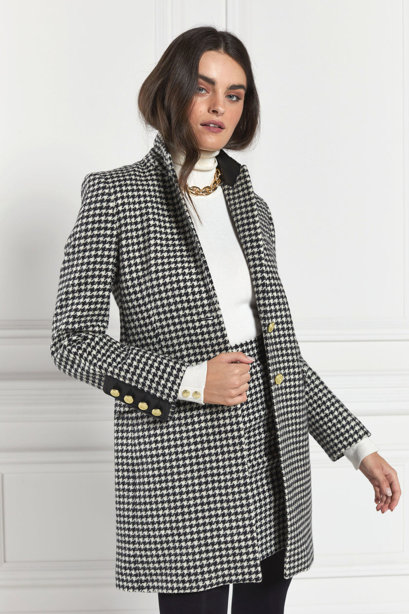 white and black houndstooth tweed womens coat with gold hardware and black leather detailing