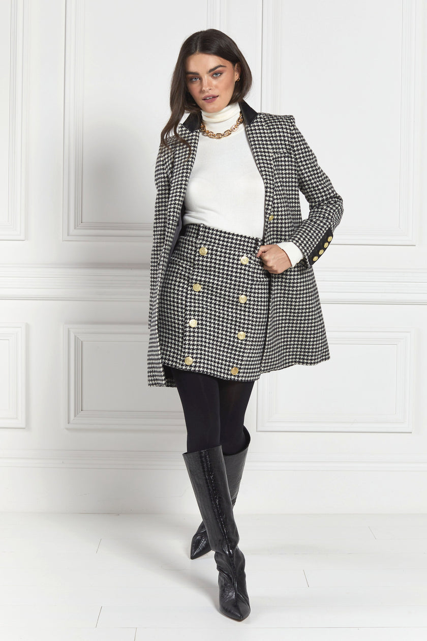 white and black houndstooth tweed womens coat with gold hardware and black leather detailing