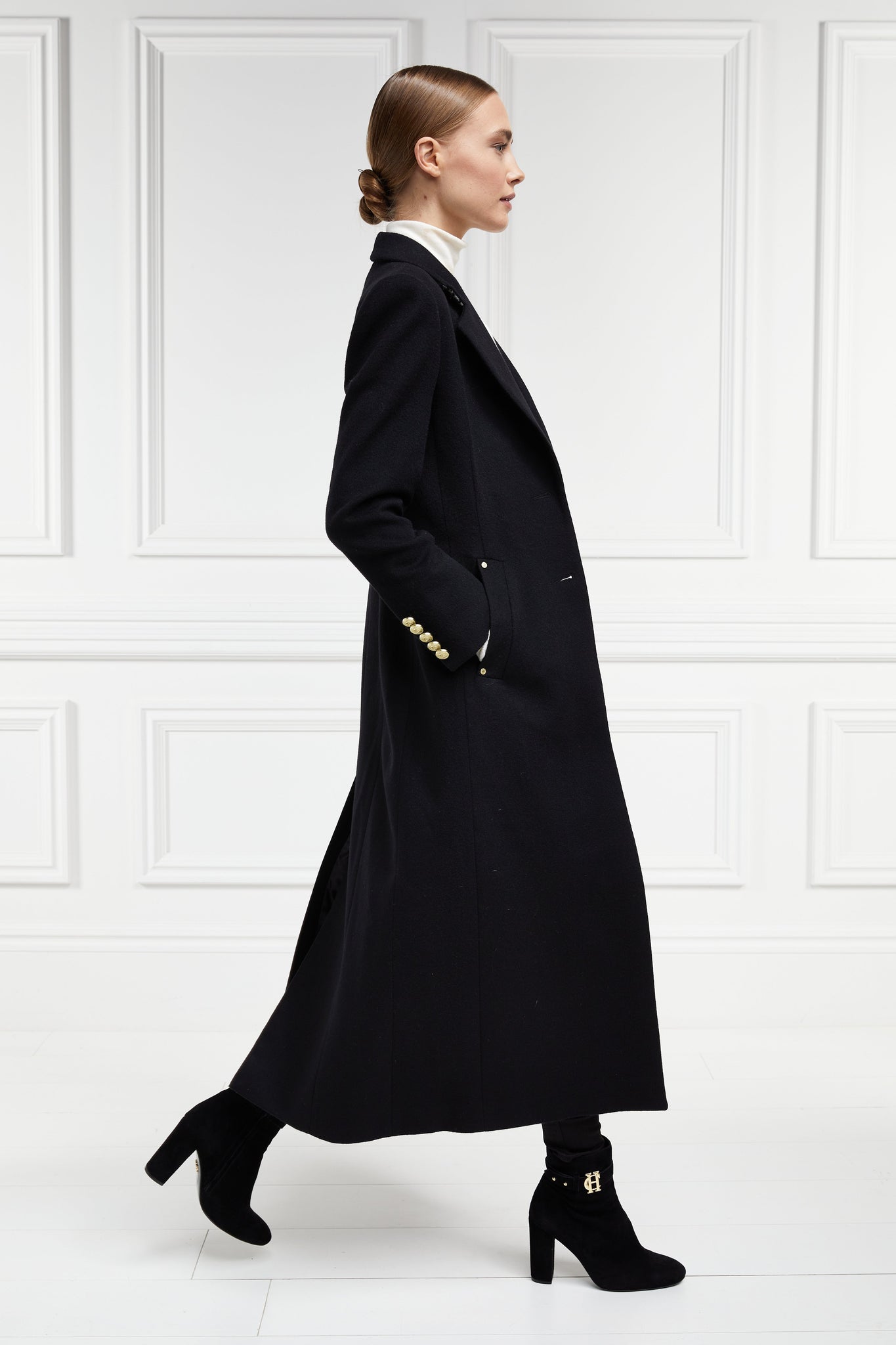 side of black single breasted full length wool coat