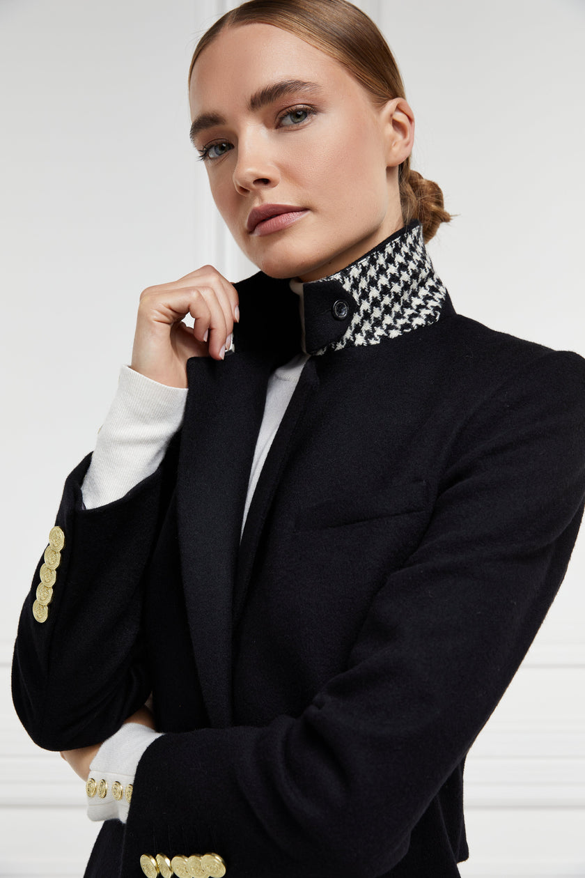 black single breasted full length wool coat with black and white houndstooth under collar detail