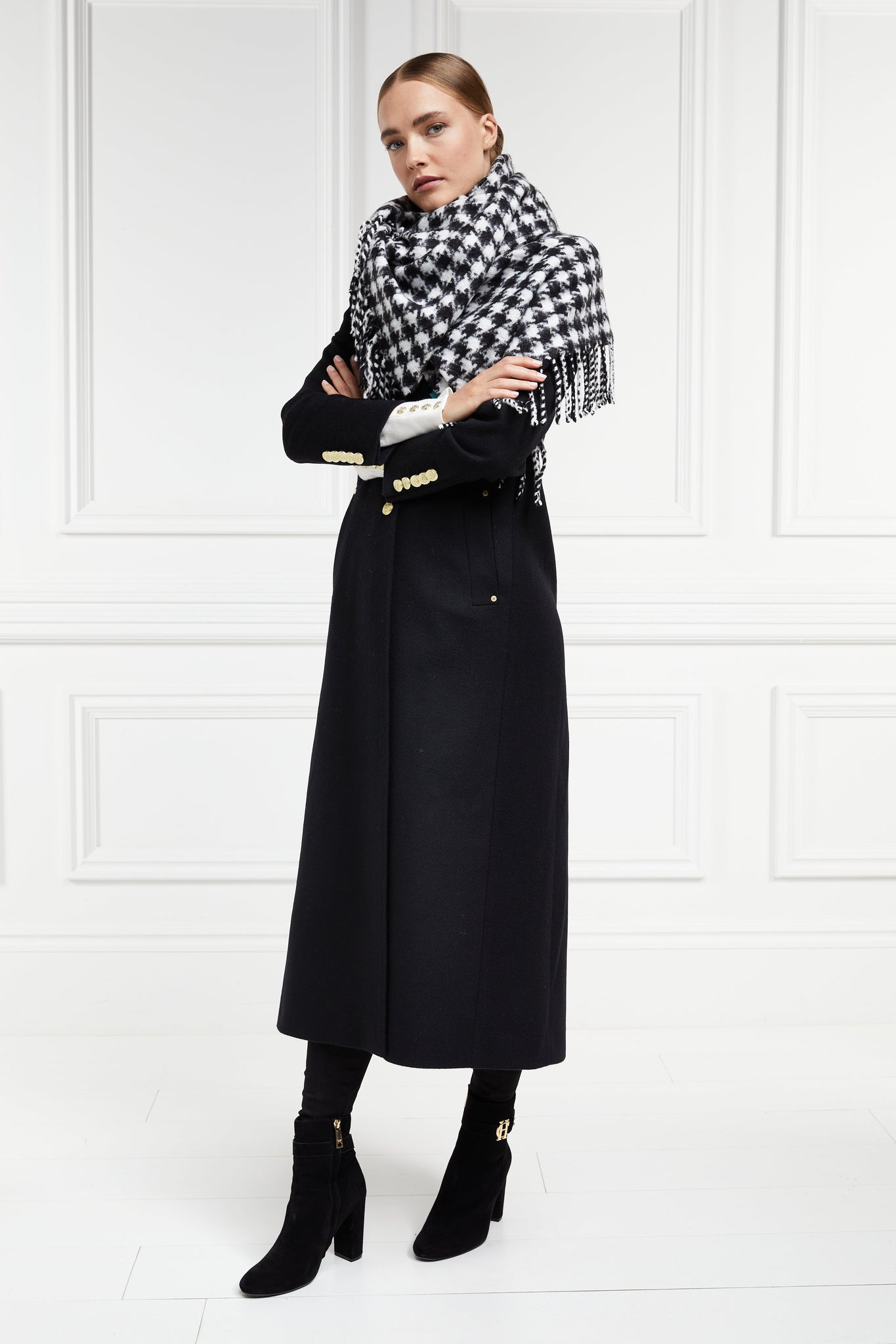 black single breasted full length wool coat with black and white houndstooth wool scarf