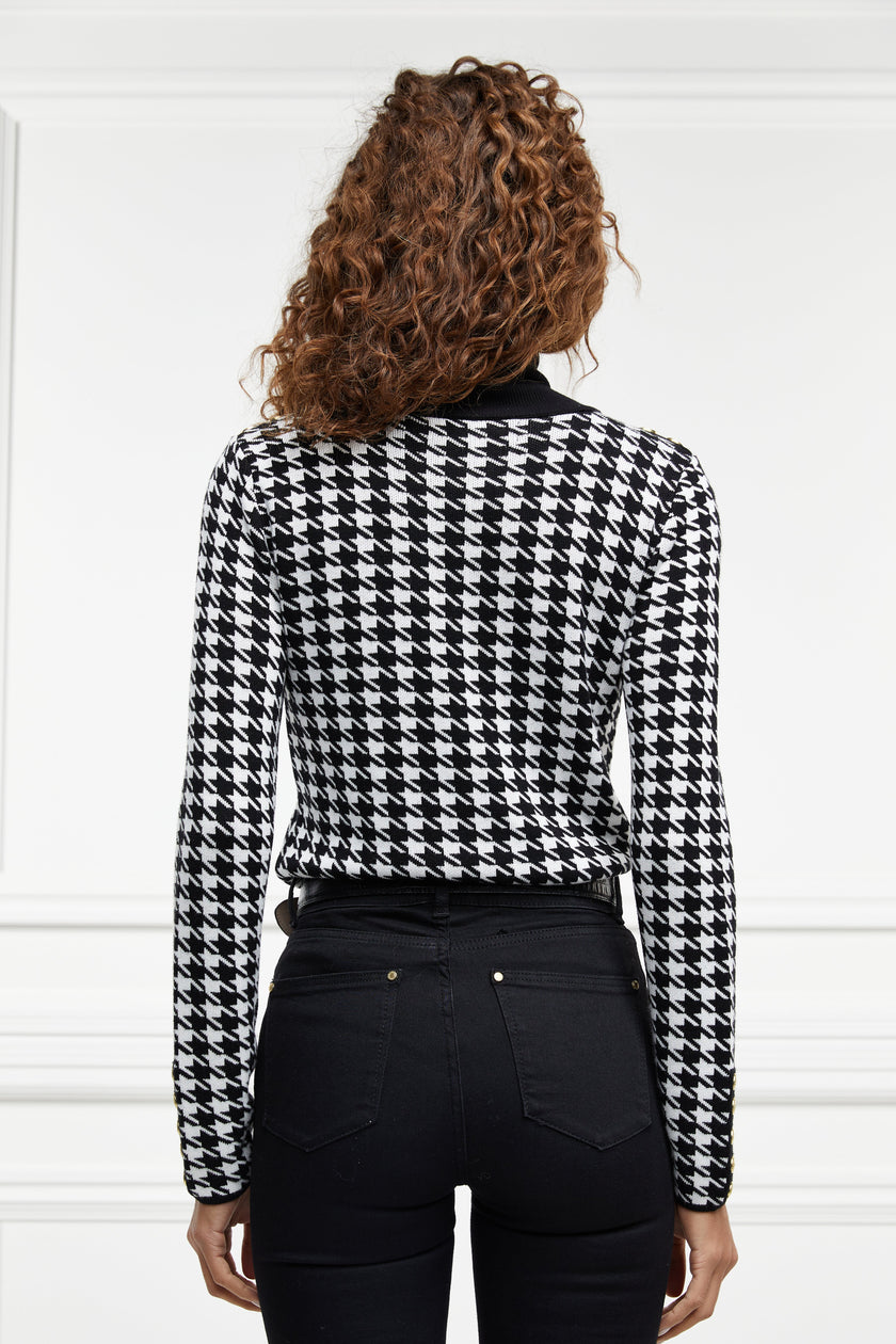 a classic black and white houndstooth jumper with contrast black roll neck collar