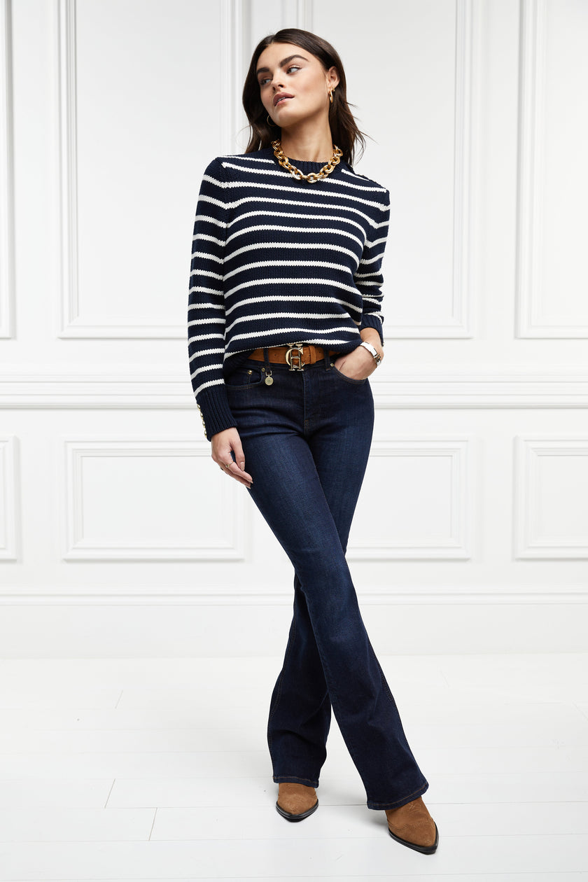 a classic navy and cream breton stripe crew neck jumper with a split ribbed hem and gold button detail on the cuffs and collar