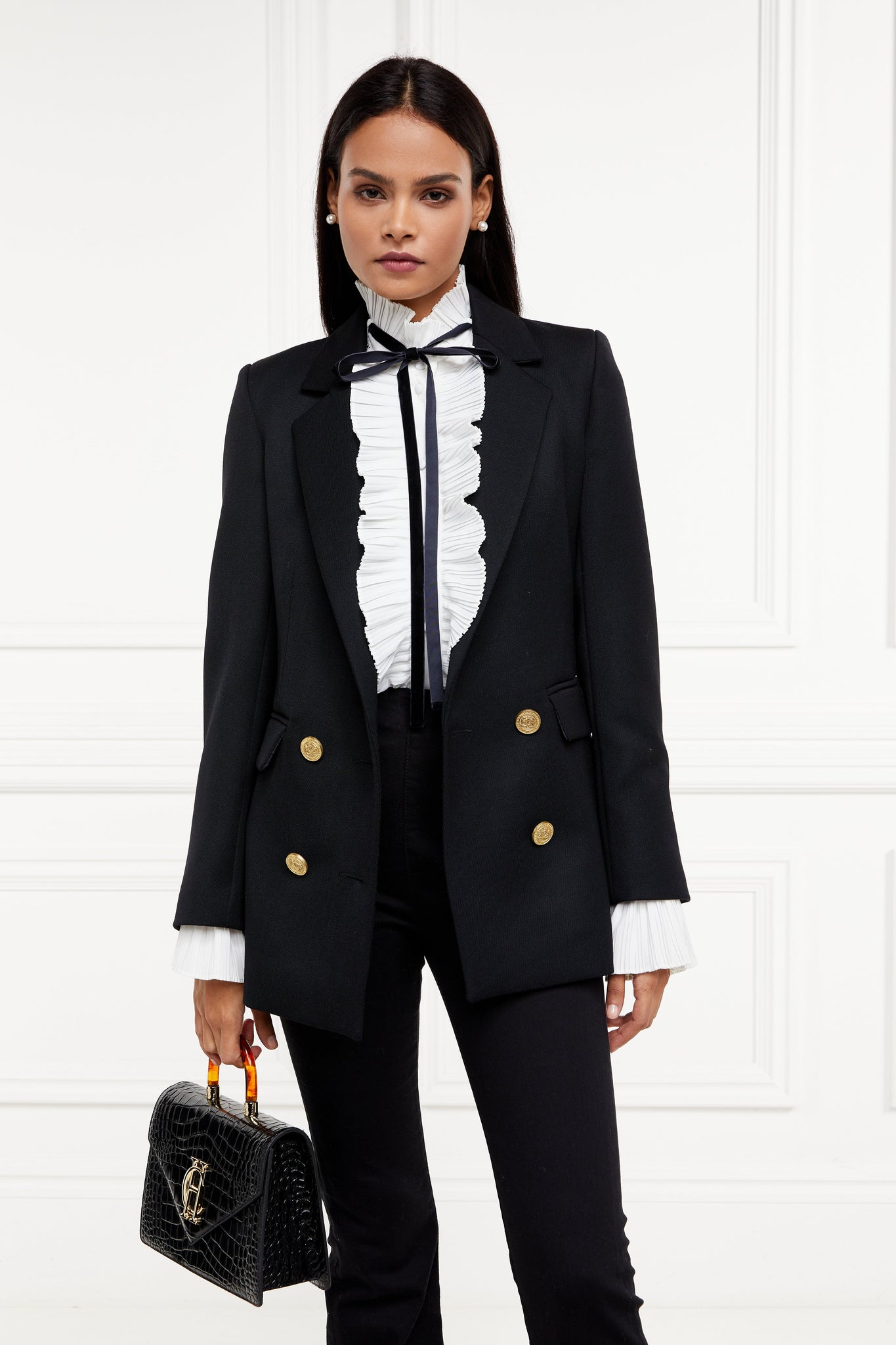 womens relaxed fit white polyester shirt with ruffled front collar and cuffs and removable black tie detail and double breasted black tweed blazer and black croc embossed bag