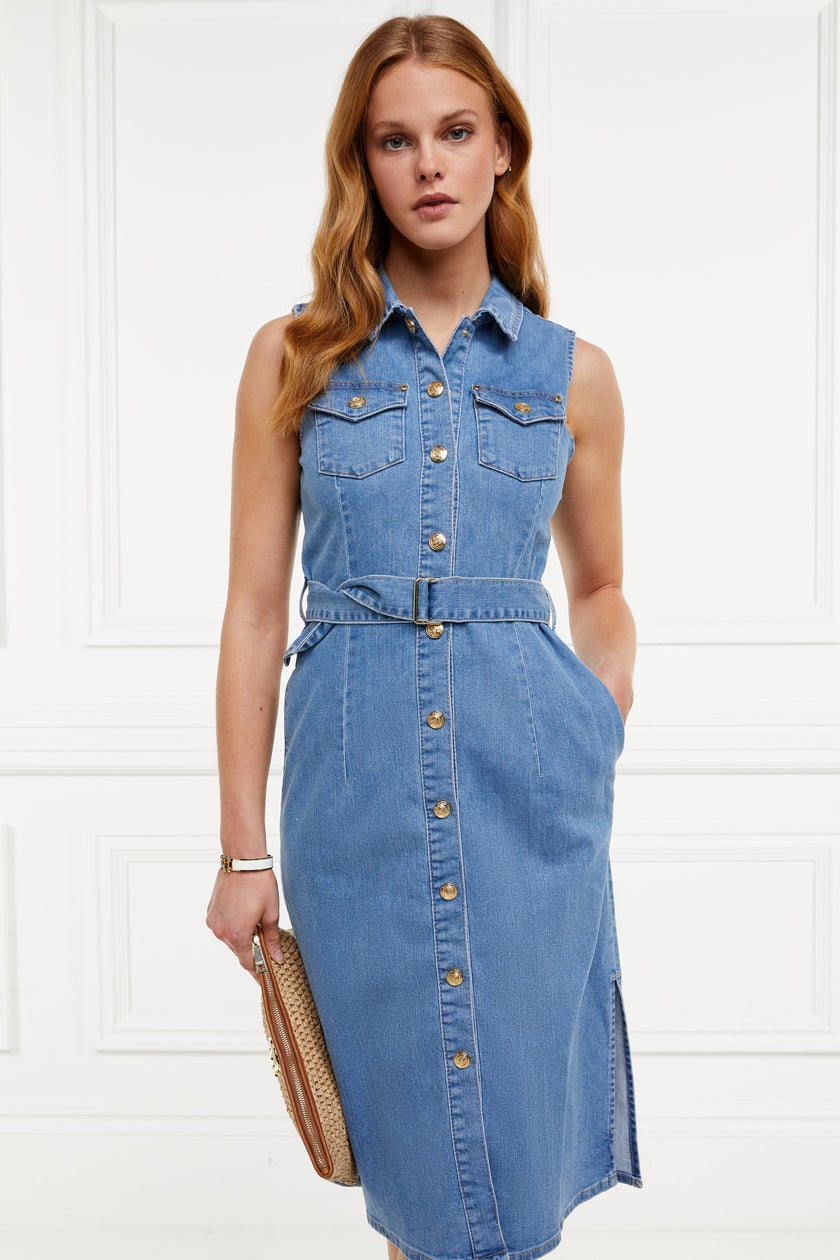 womens blue denim sleeveless midi dress with tie around the waist and gold buttons down the front