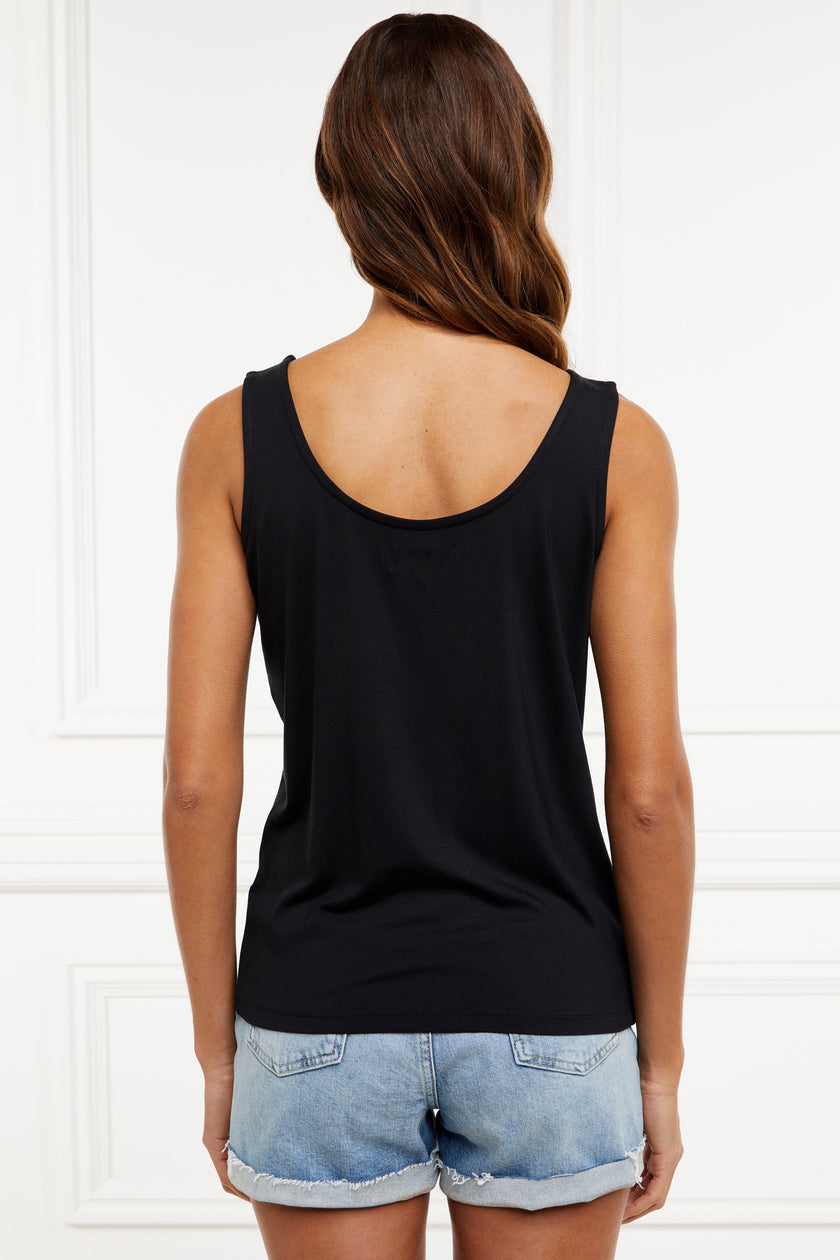 back of black scoop neck vest with loose fit and Holland Cooper hardware to each shoulder