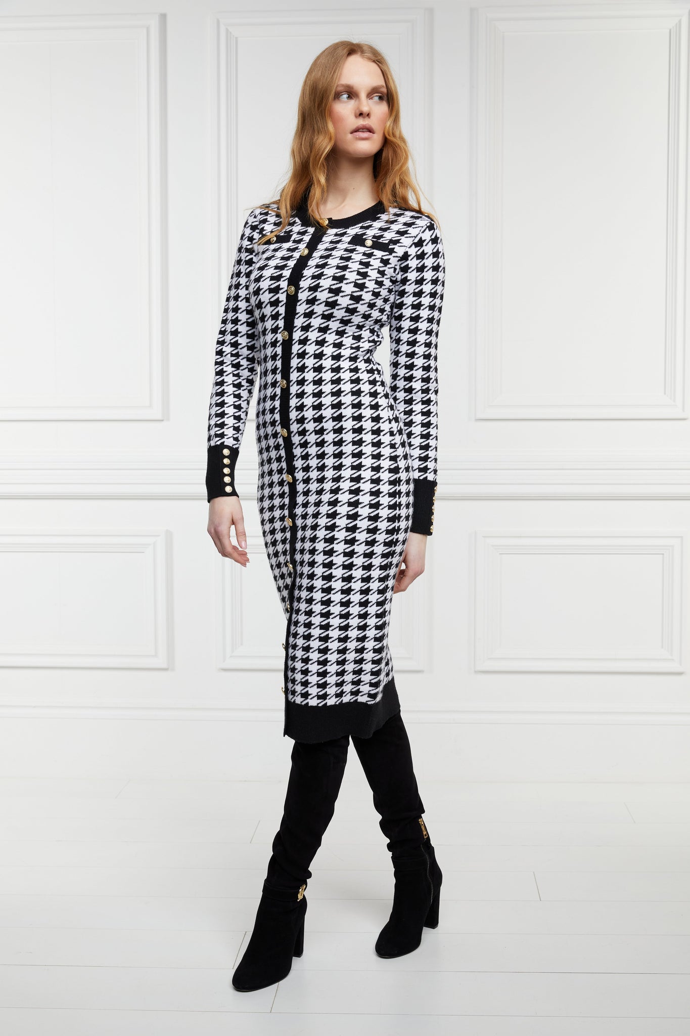 womens slim fit crew neck long sleeve knitted midi dress in white and black houndstooth with gold button detail on contrast black panel down the centre front and two black contrast welt pockets on chest and two on the hips with gold buttons on the centre of each and contrasting black ribbed hem neckline and cuffs