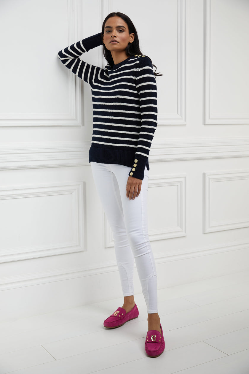 a classic navy and cream breton stripe crew neck jumper with a split ribbed hem and gold button detail on the cuffs and collar