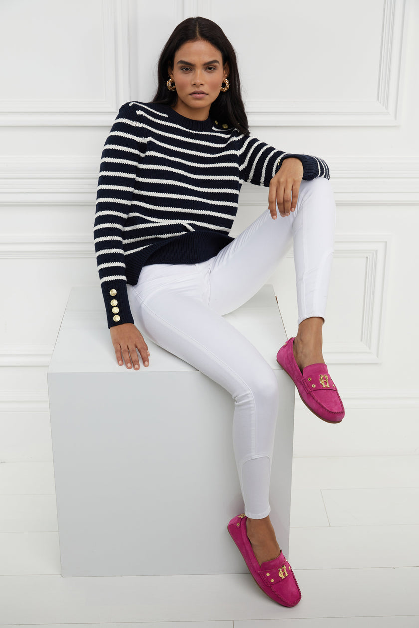 a classic navy and cream breton stripe crew neck jumper with a split ribbed hem and gold button detail on the cuffs and collar