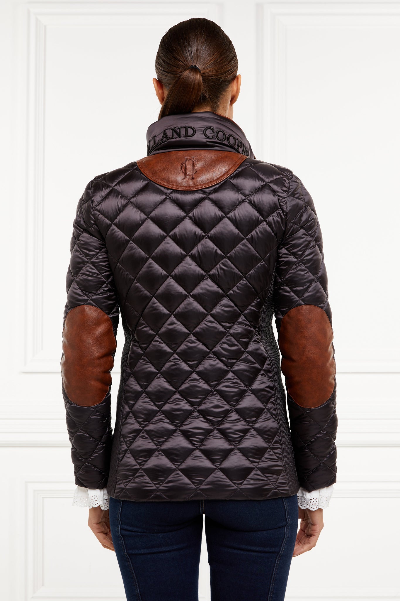 back of womens diamond quilted chocolate jacket with contrast tan leather elbow and shoulder pads large front pockets and shirred side panels