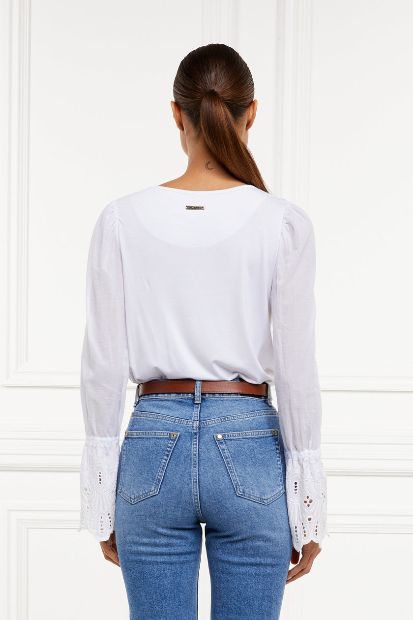 back image of Crew neck top with voluminous sleeves with gathered details at the shoulder and broderie detailing above the cuff and detailed with Holland Cooper rivets on the shoulders and subtle gold placket on the balk yolk