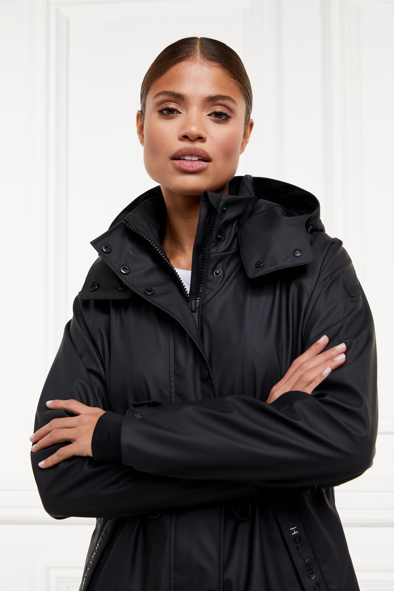 womens black hooded rain coat with black hardware 