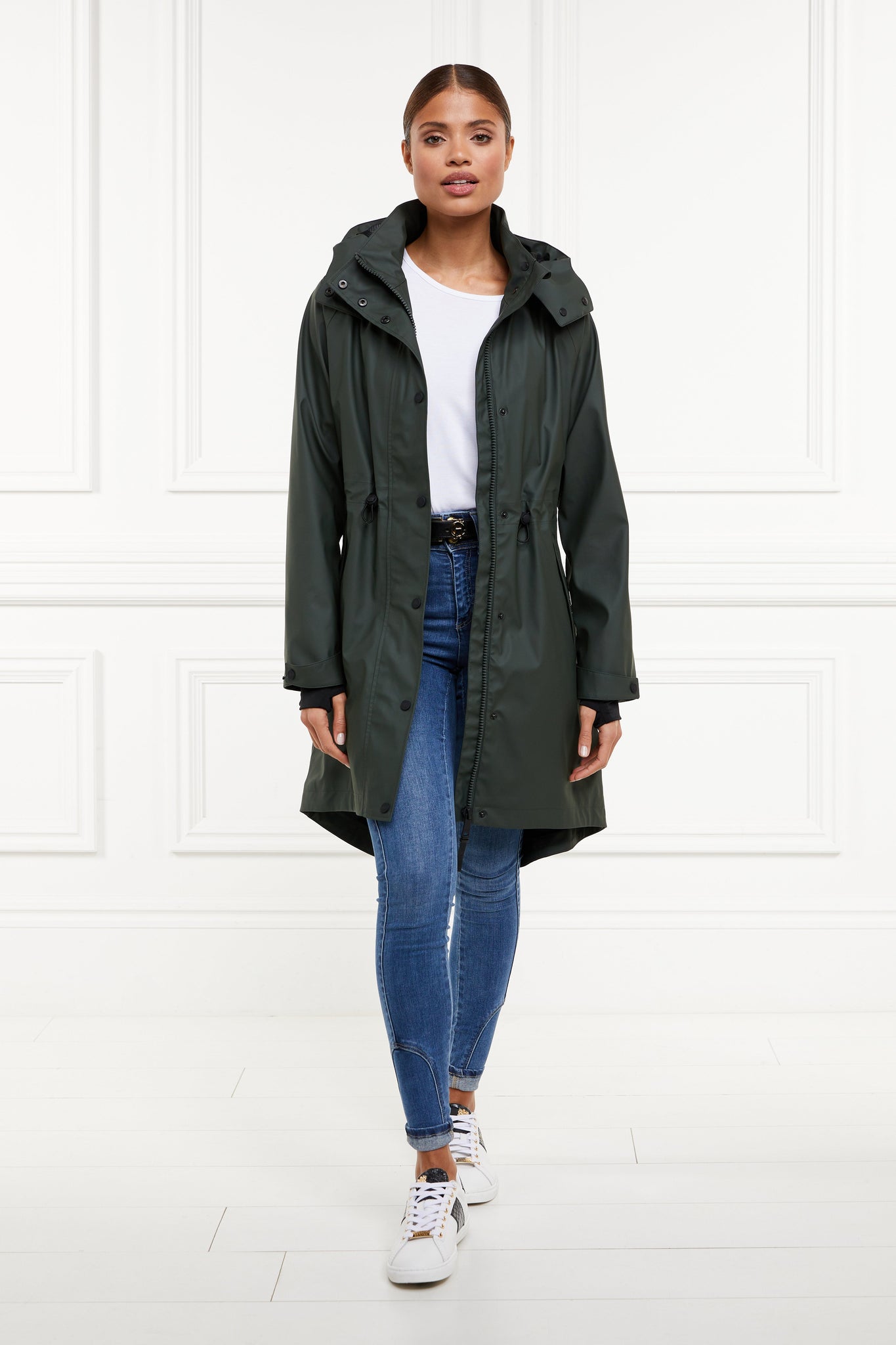 womens green hooded rain coat with black hardware 