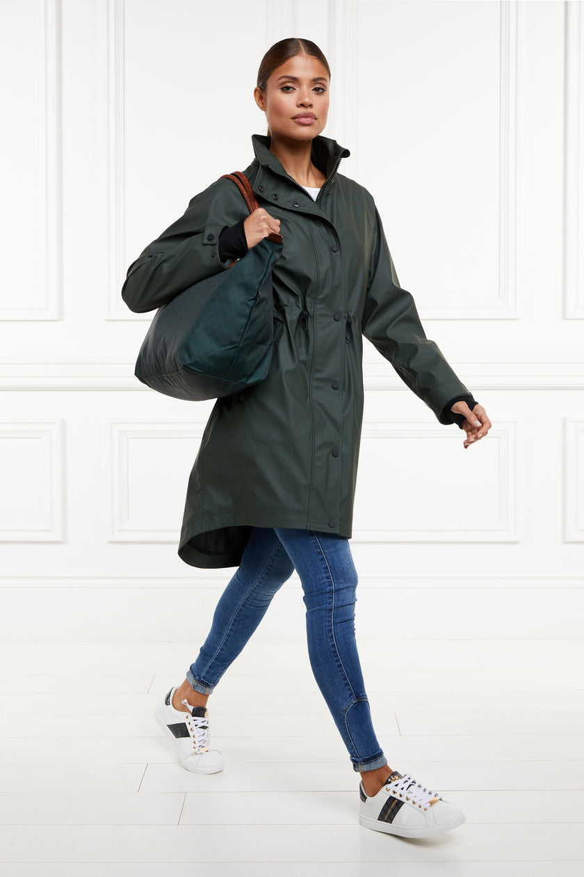 womens green hooded rain coat with black hardware 