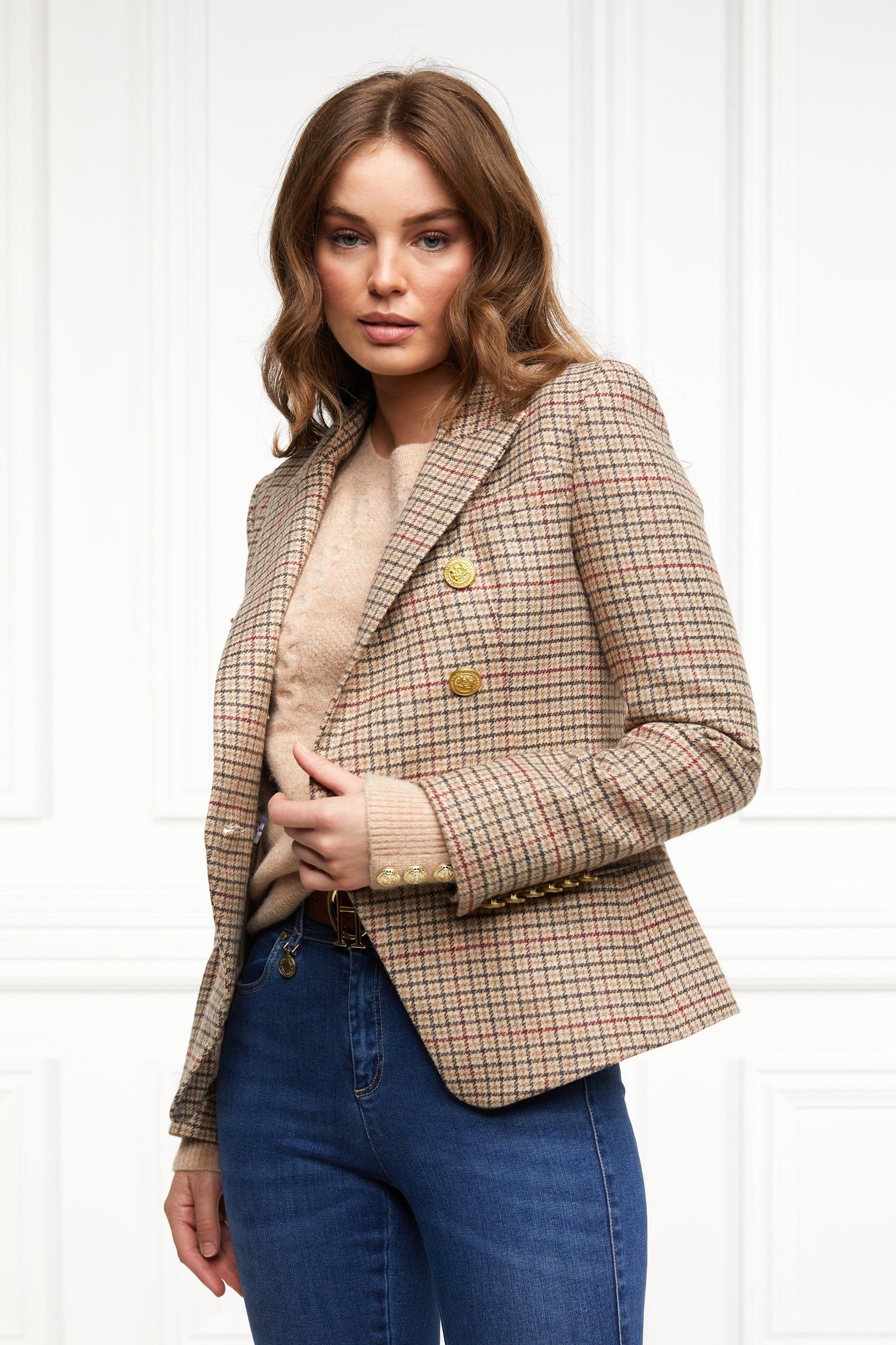 British made double breasted blazer that fastens with a single button hole to create a more form fitting silhouette with two pockets and gold button detailing this blazer is made from camel black and red check charlton tweed