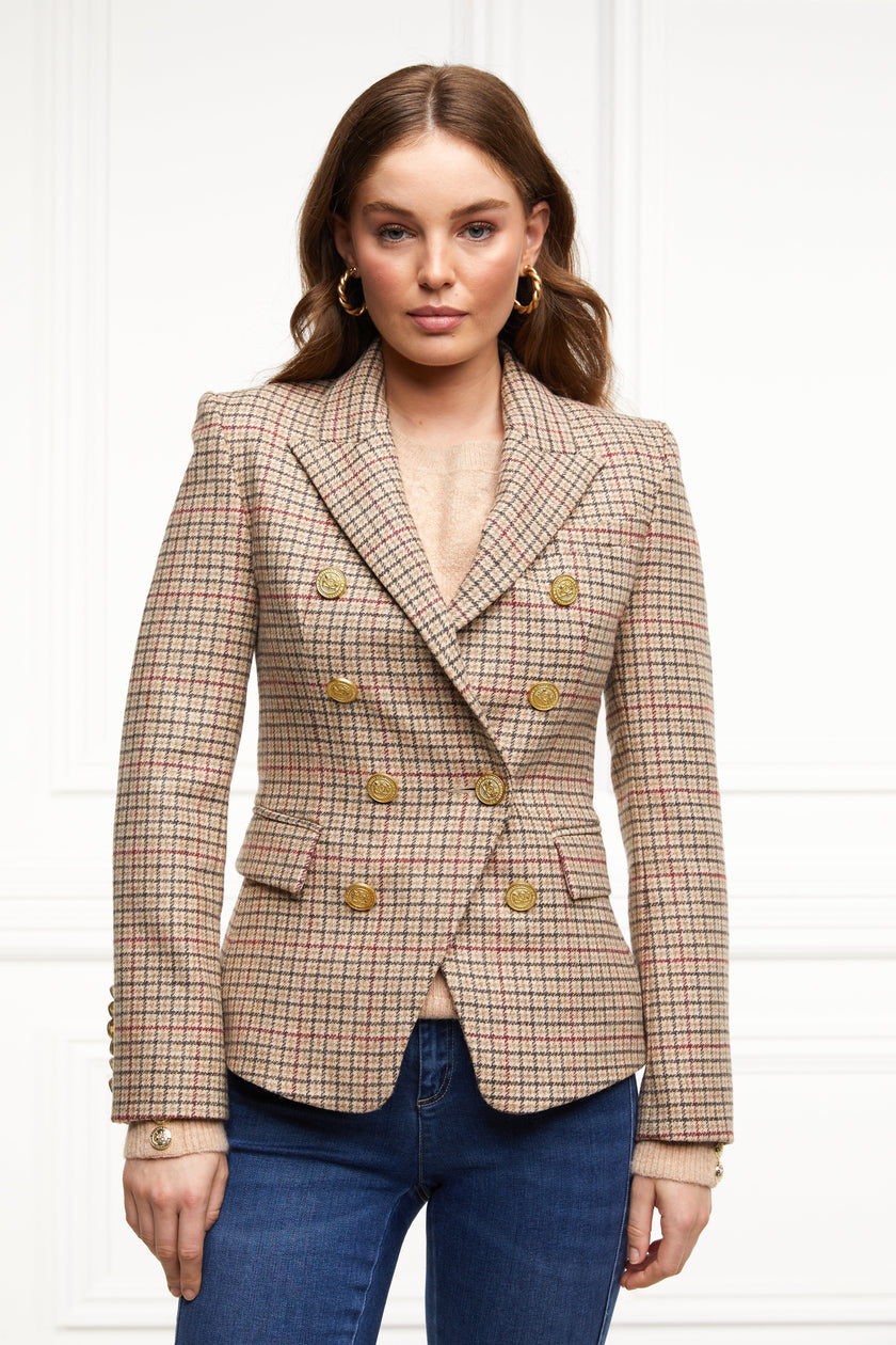 British made double breasted blazer that fastens with a single button hole to create a more form fitting silhouette with two pockets and gold button detailing this blazer is made from camel black and red check charleton tweed