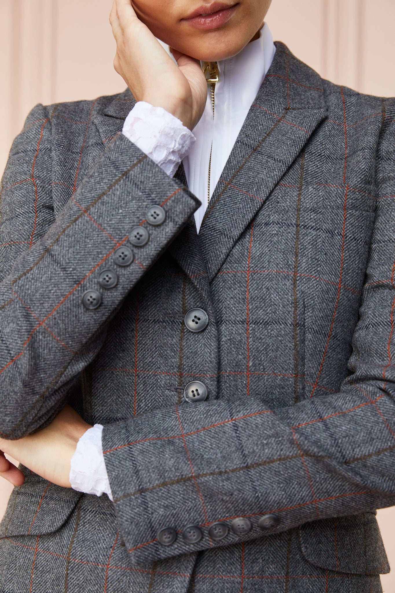 detail shot of womens grey tweed riding jacket 