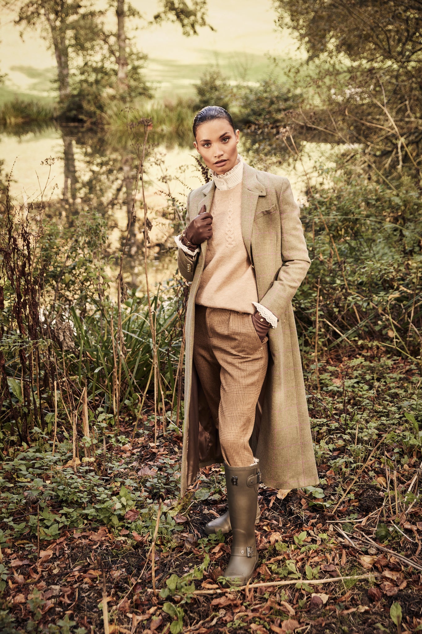 womens green and pink check single breasted full length wool coat with brown check tailored trousers and green wellingtons