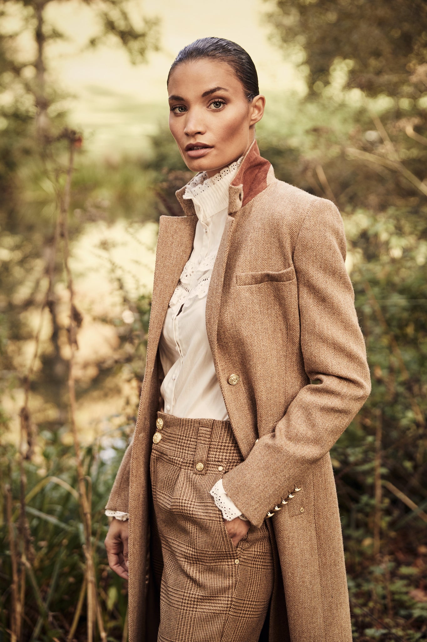 White blouse with long sleeves and a slim fit with delicate lace trim to both the collar and cuff edges with flattering lace details to the front body