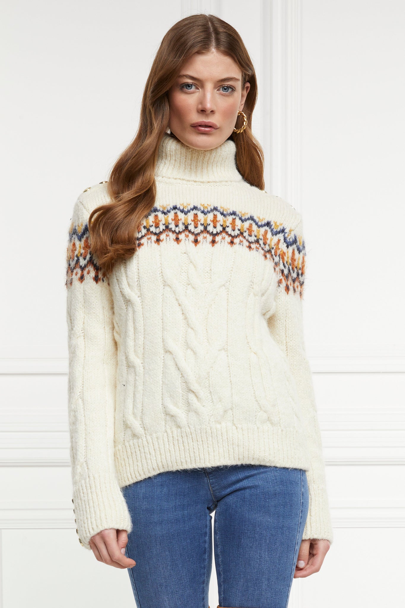 high roll neck cable knit jumper in cream with a blue orange and yellow fairisle knit detail across the chest around the upper arm and back