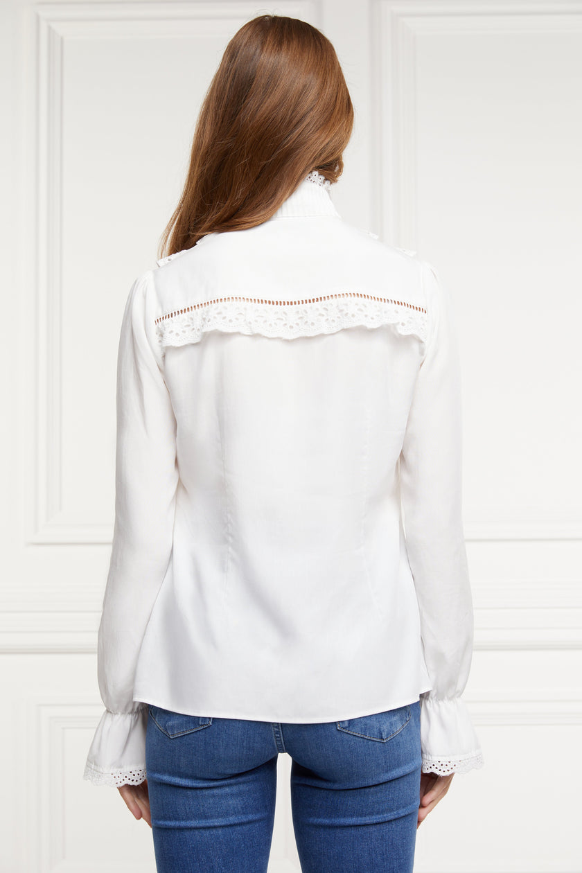 back image of white blouse with long sleeves and a slim fit with delicate lace trim to both the collar and cuff edges with flattering lace details to the front body