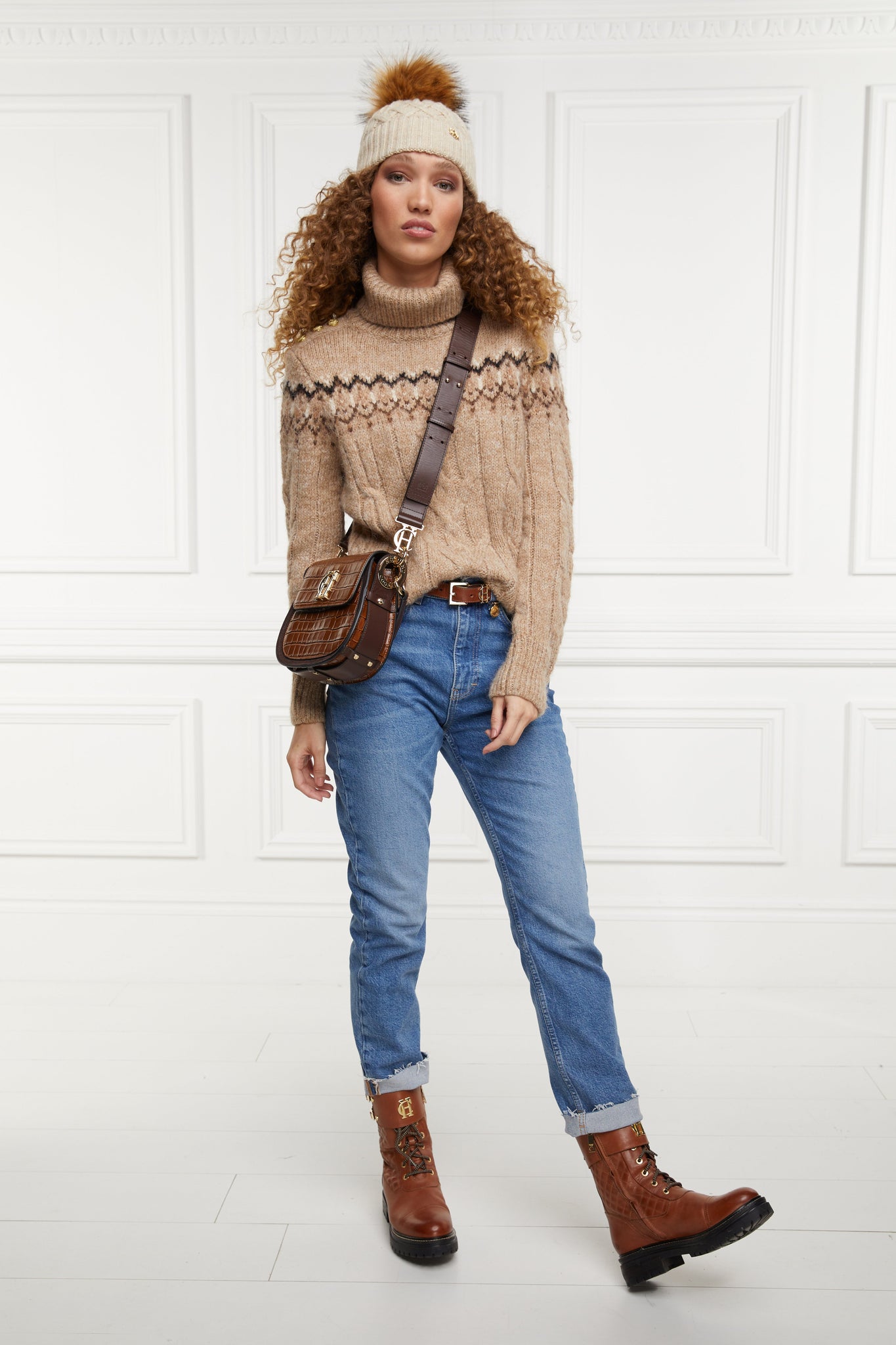 high roll neck cable knit jumper in camel with a black cream and dark camel fairisle knit detail across the chest around the upper arm and back