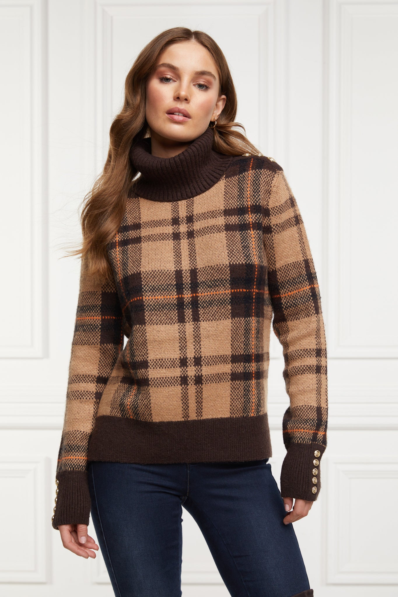 a classic camel check jumper with contrast brown cuffs, roll neck and split ribbed hem with gold button detail on the cuffs and collar