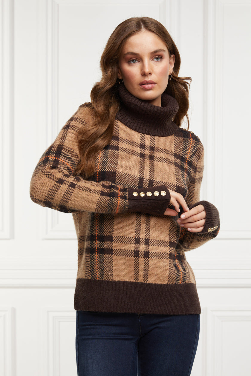 a classic camel check jumper with contrast brown cuffs, roll neck and split ribbed hem with gold button detail on the cuffs and collar