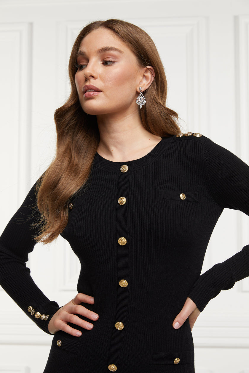 womens slim fit crew neck long sleeve knitted midi dress in black with gold button detail down the centre front and two welt pockets on chest and two on the hips with gold buttons on the centre of each pocket