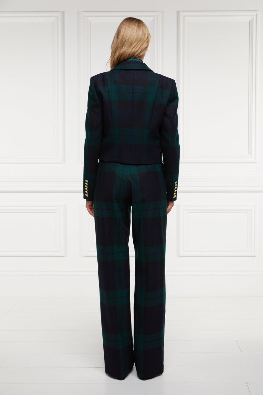 back of British made tailored cropped jacket in navy and green blackwatch tarten with welt pockets and gold button detail down the front and on sleeves