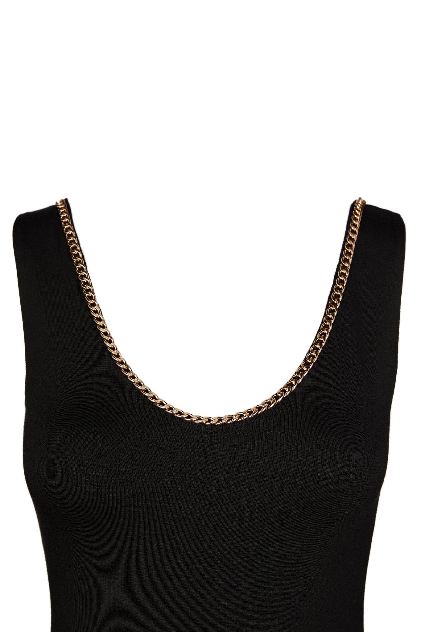 detailed shot of gold chain on womens black v neck dress