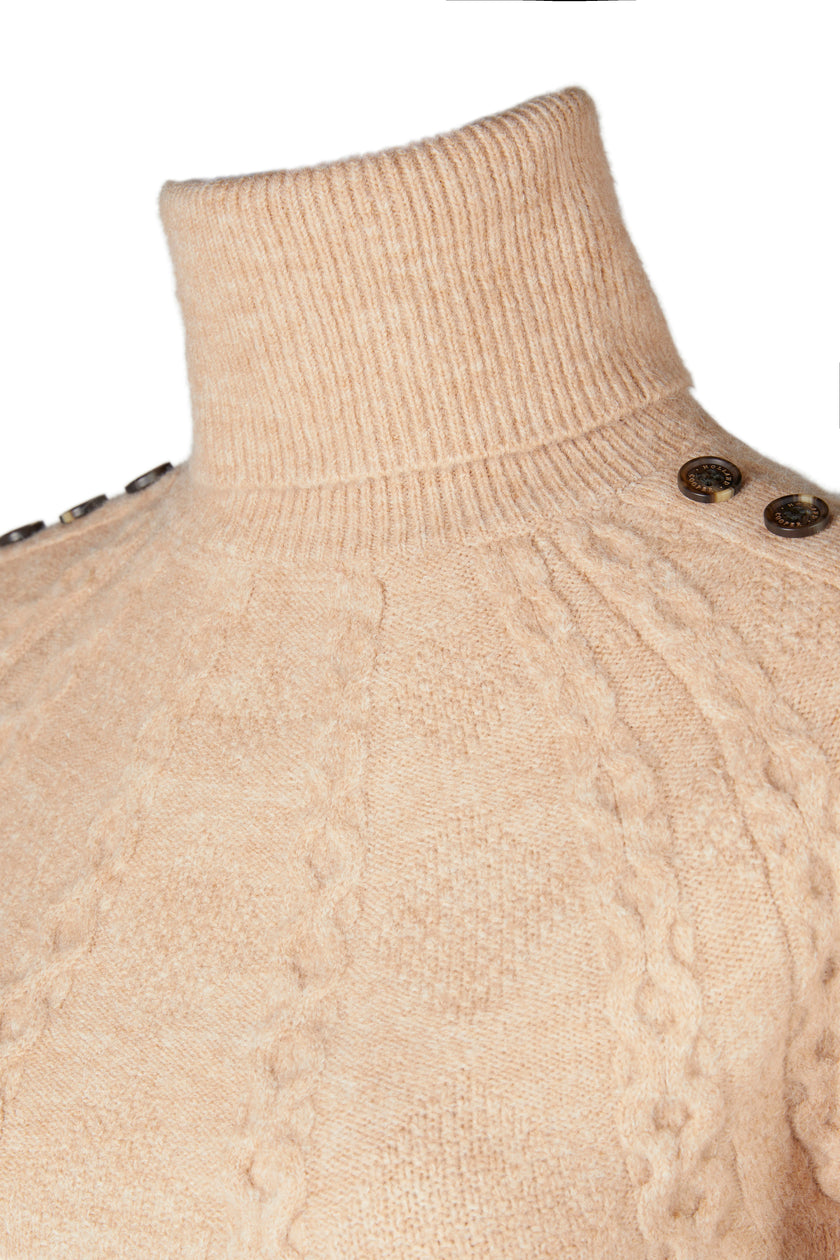 roll neck detail of chunky knit roll neck jumper in camel with textured knit detailing and horn buttons across both shoulders