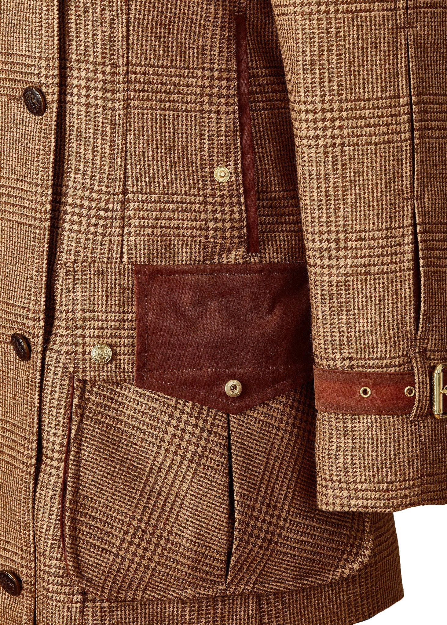 Closed pocket detail of tan brown tartan tweed field coat