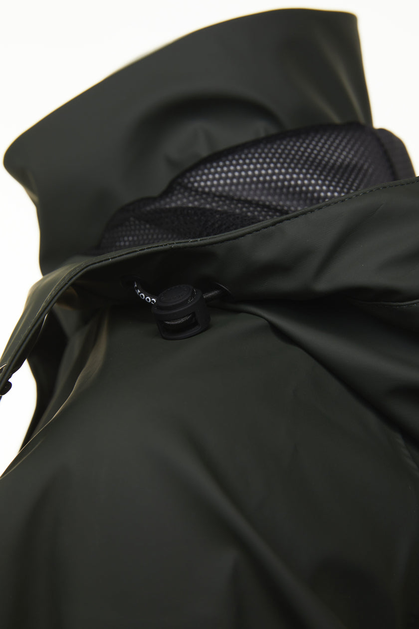 detail of womens green hooded rain coat with black hardware 