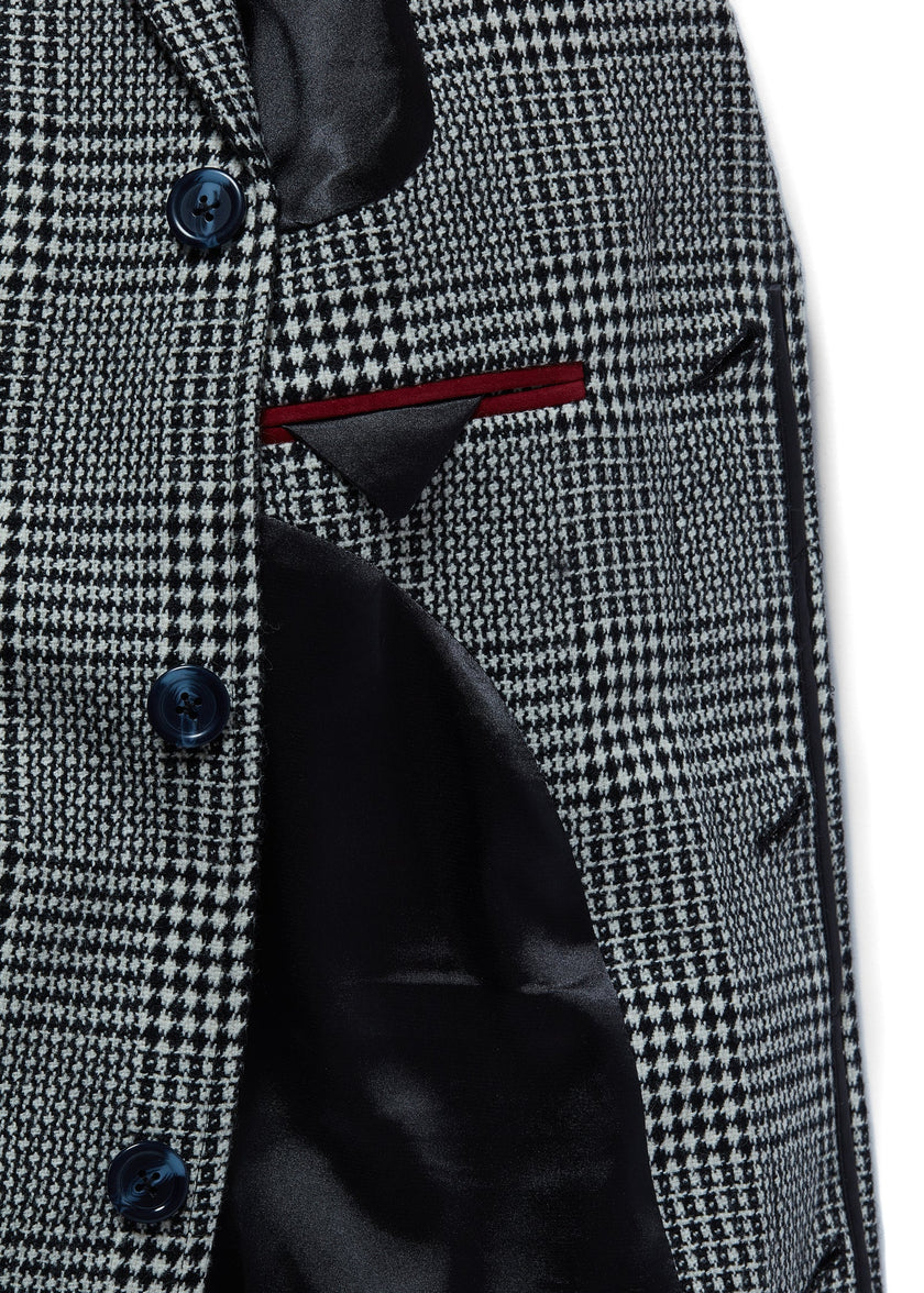 Inner shot of black and white tweed mens coat