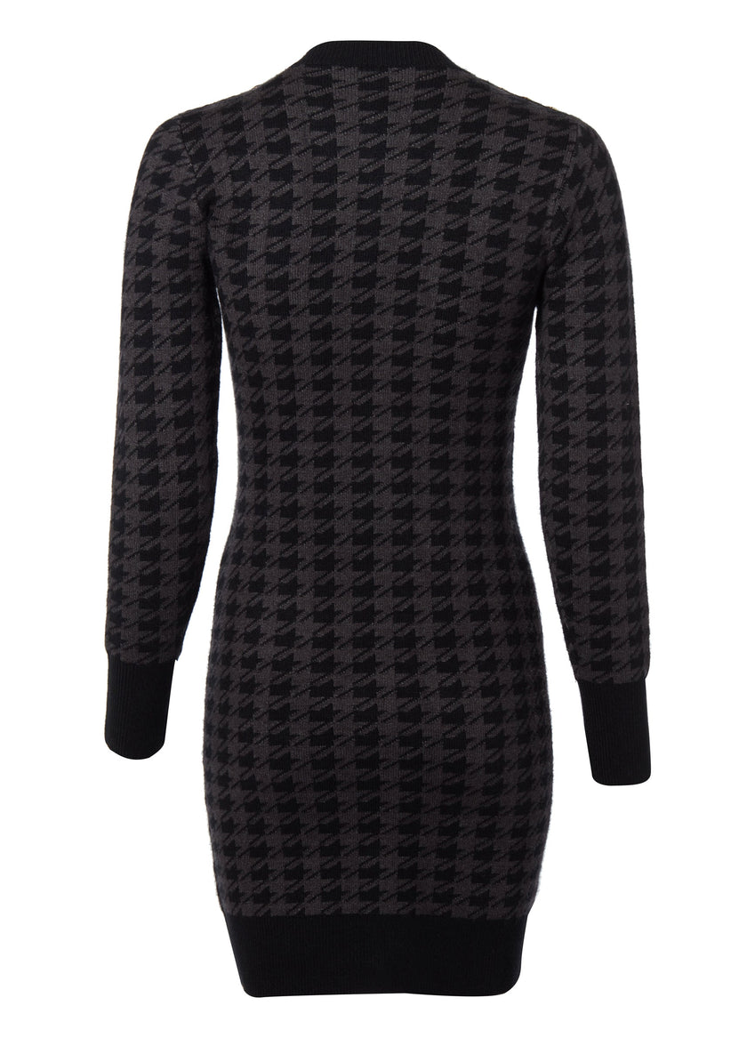 back of womens slim fit crew neck long sleeve knitted dress in grey and black houndstooth with gold button detail on contrast black panel down the centre front and two black contrast welt pockets on chest and two on the hips with gold buttons on the centre of each and contrasting black ribbed hem neckline and cuffs