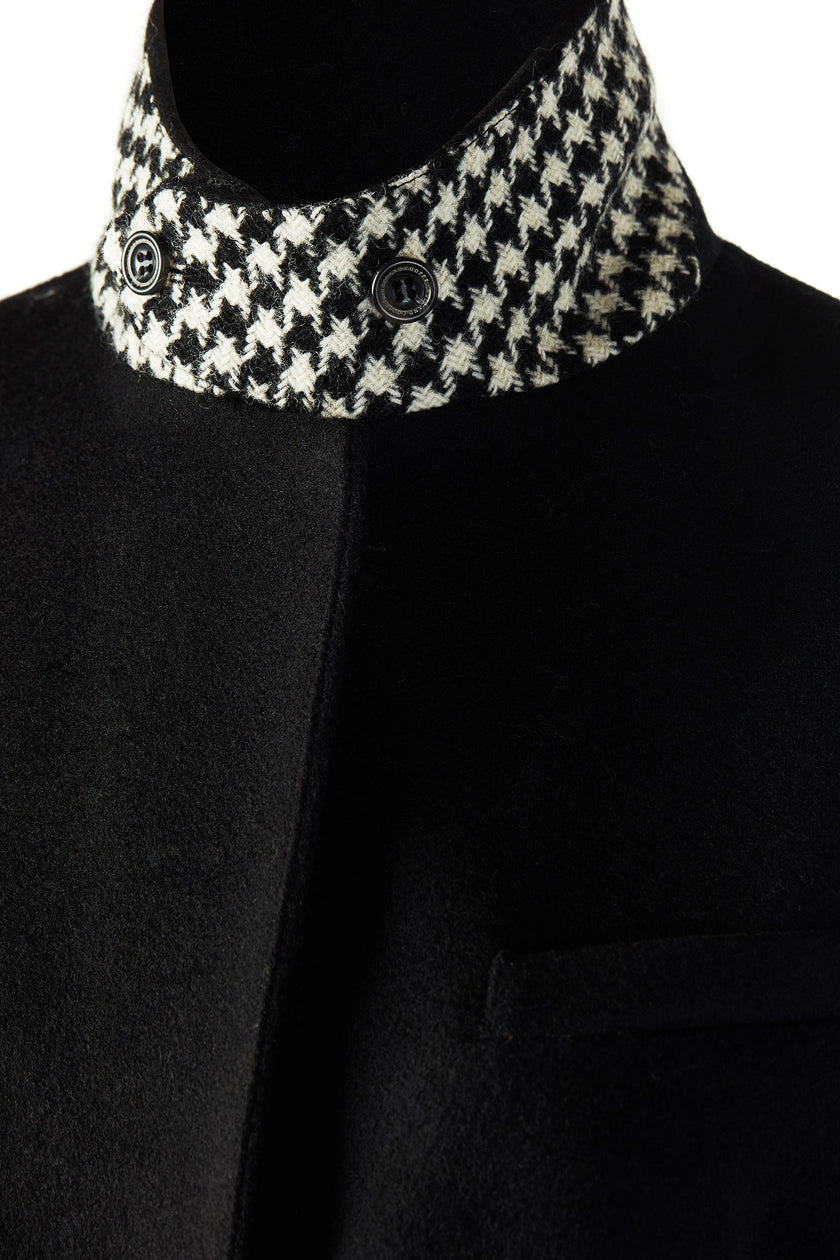 black single breasted full length wool coat with black and white houndstooth under collar detail