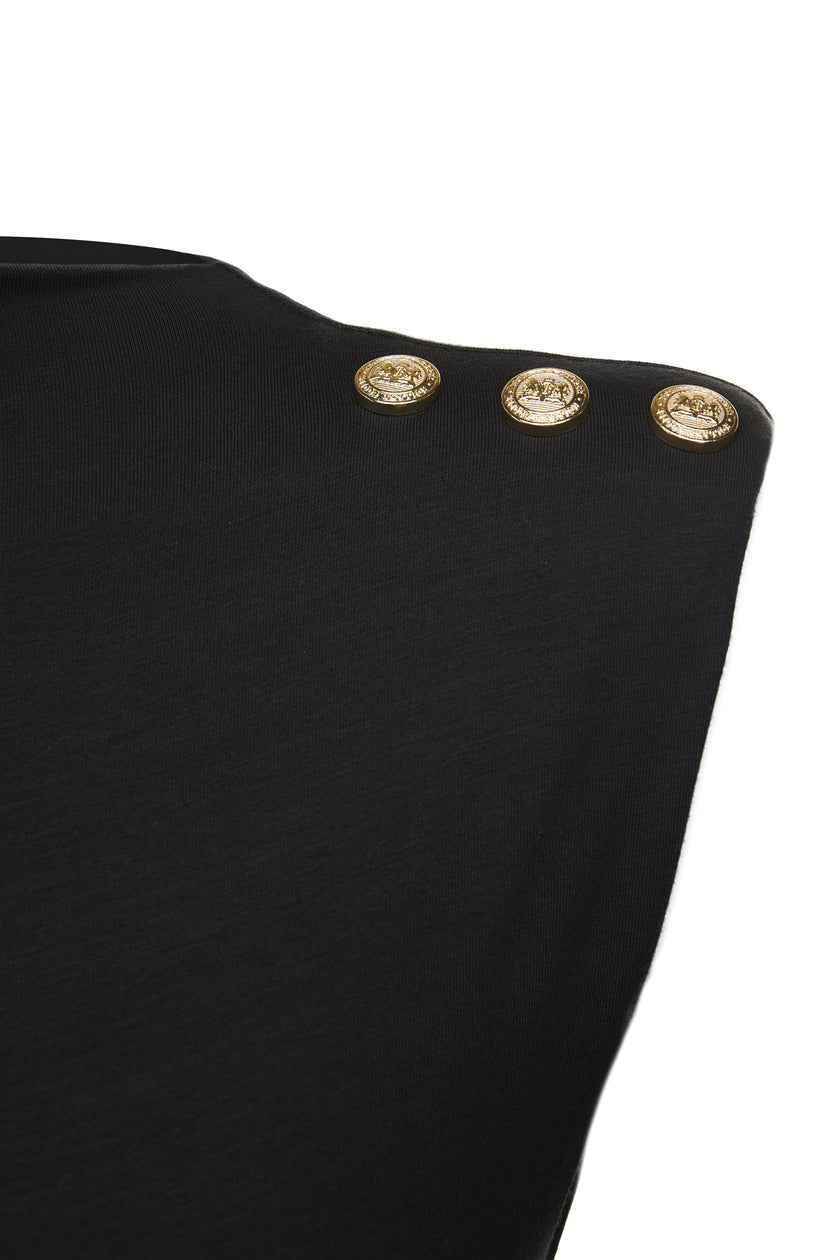 detail shot of gold buttons on shoulder of womens black maxi dress