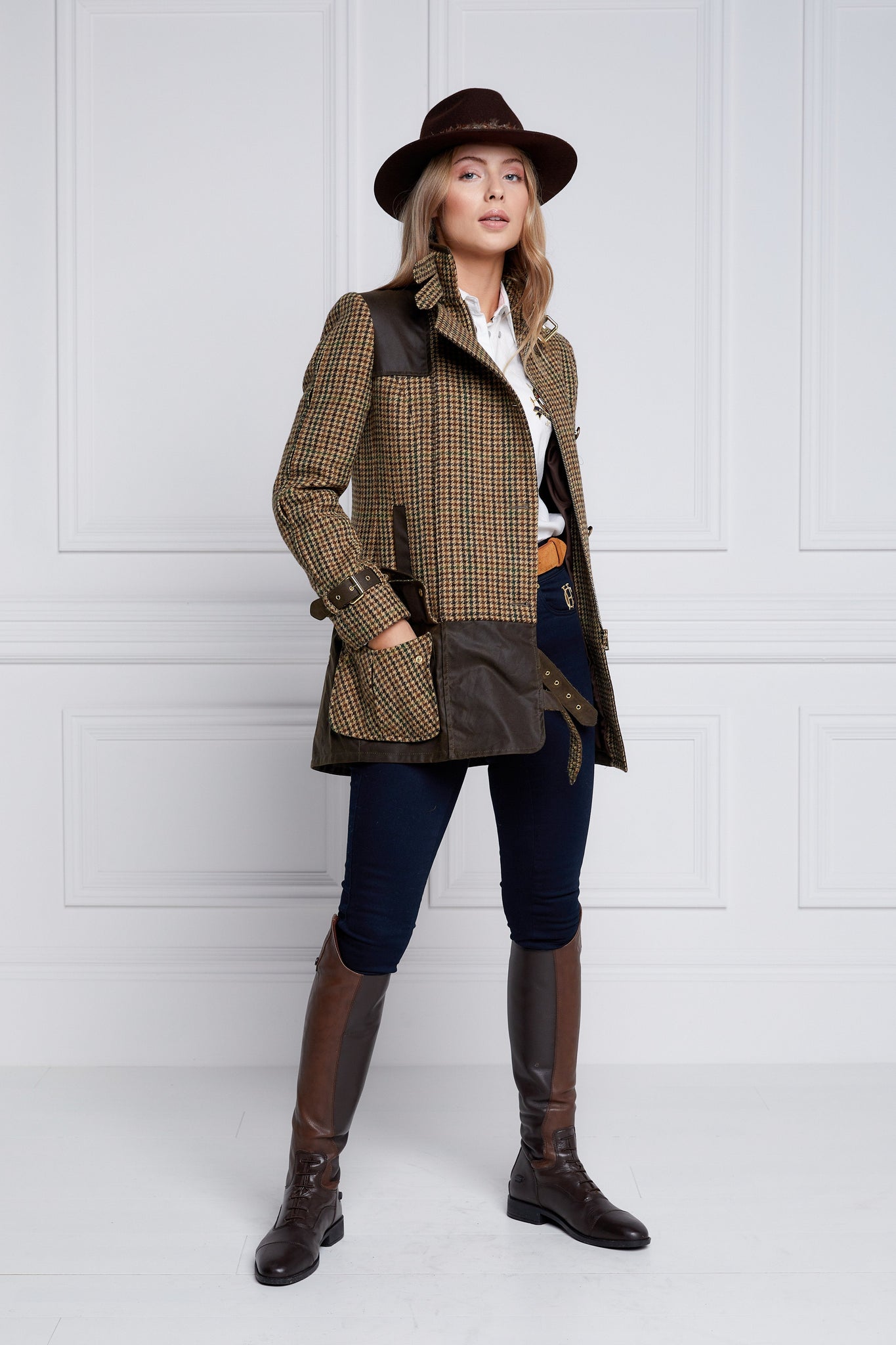 womens fitted field jacket in stone brown and green houndstooth tweed trimmed with contrast chocolate Millerain Wax fabric on shoulder across back and on the hip finished with horn button fastenings an buckles on the collar cuffs and hip