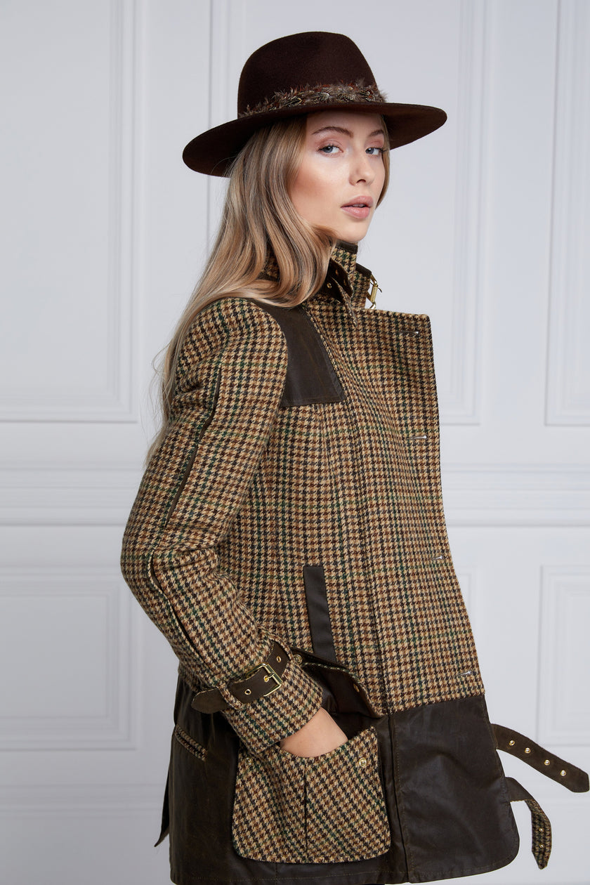 womens fitted field jacket in stone brown and green houndstooth tweed trimmed with contrast chocolate Millerain Wax fabric on shoulder across back and on the hip finished with horn button fastenings an buckles on the collar cuffs and hip