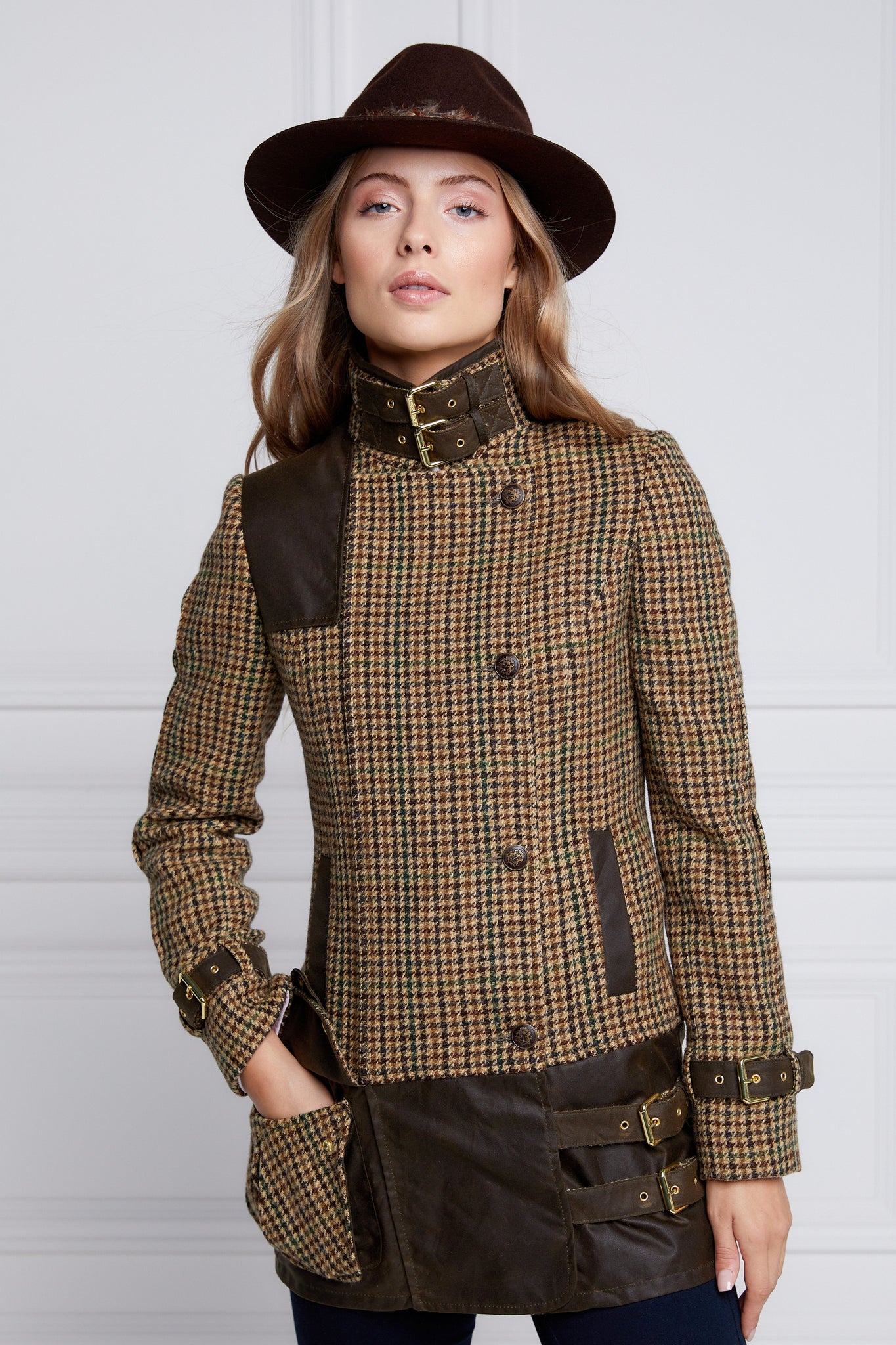 womens fitted field jacket in stone brown and green houndstooth tweed trimmed with contrast chocolate Millerain Wax fabric on shoulder across back and on the hip finished with horn button fastenings an buckles on the collar cuffs and hip