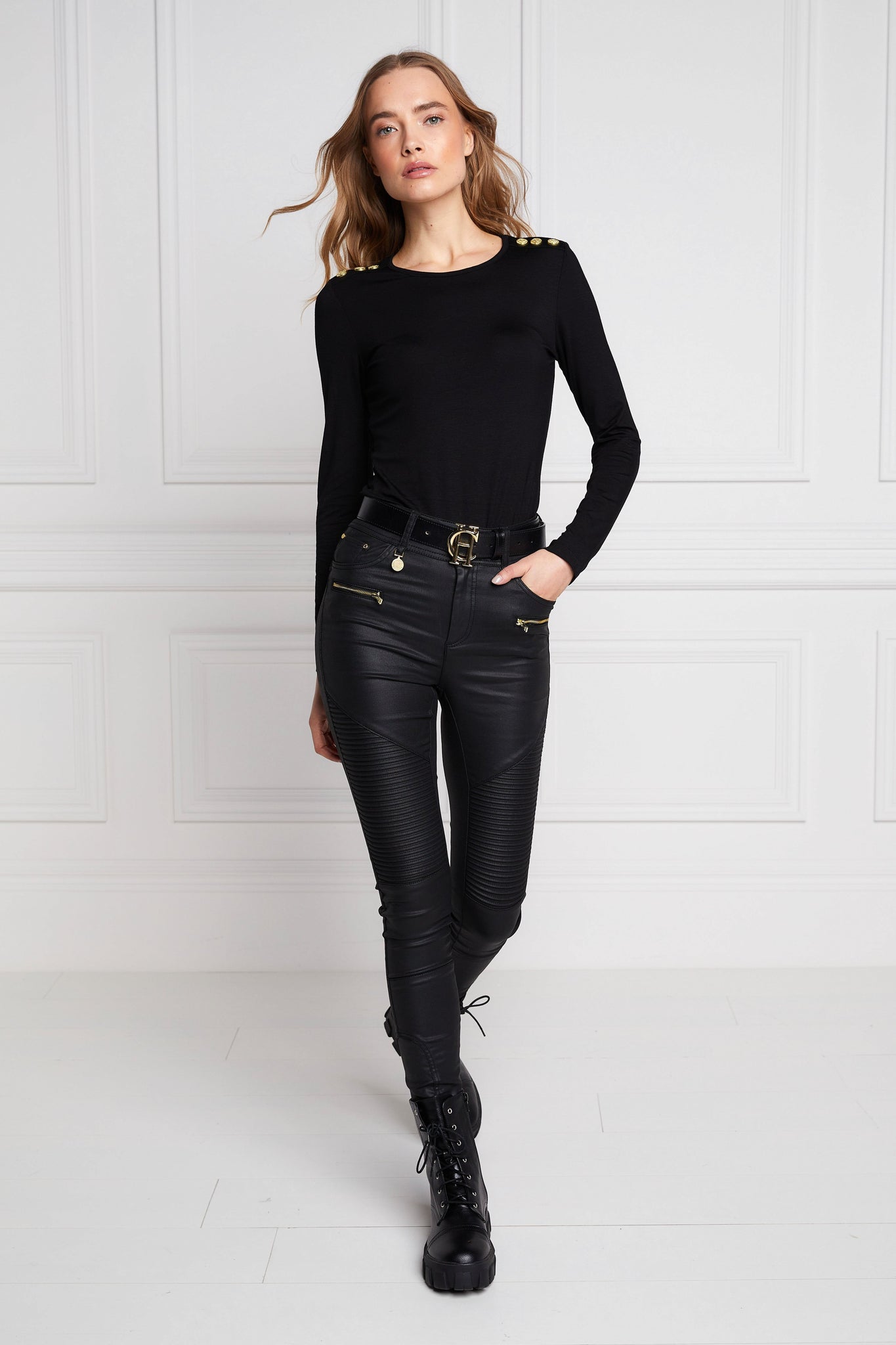 womens high rise black coated skinny jean for a leather look with pin tuck biker panels to front and two open zip pockets on front with two open pockets on back